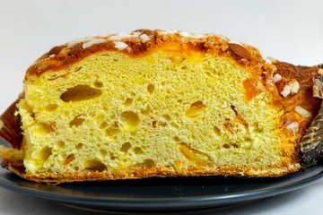 Panettone, Italian Christmas bread, with a brioche-like dough infused with a vanilla bean and studded with rum-soaked raisins and candied orange peel