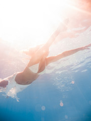 Fototapeta premium Woman underwater at the pool