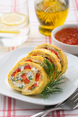 Egg roll with red pepper, cream cheese, dill and herbs, vertical orientation