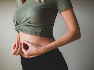 Slim Woman's Waist. People, sport, fitness and health concept. Close-up