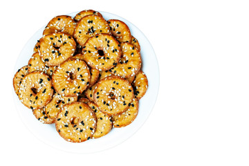 biscuit crackers with sesame seeds, isolated with space for text