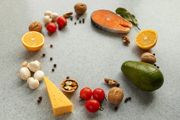 Healthy food with low carb content, on a gray table. The concept of a ketogenic diet, health and youth. Ingredients of the keto diet, protein food. The view from the top. Space for copying.