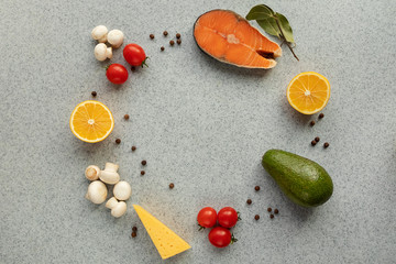 Healthy food with low carb content, on a gray table. The concept of a ketogenic diet, health and youth. Ingredients of the keto diet, protein food. The view from the top. Space for copying.