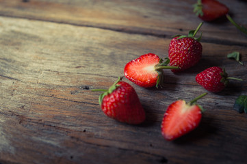 closeup of strawberry fruit on grunge wooden