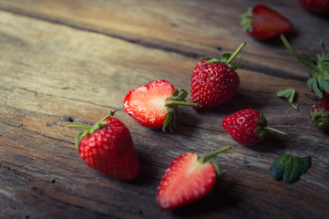 closeup of strawberry fruit on grunge wooden