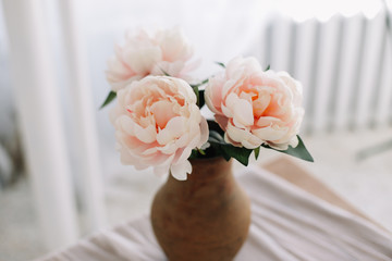 Bouquet of peonies in a vase. Floral background. Romantic background for wedding invitations and greeting cards. place for text