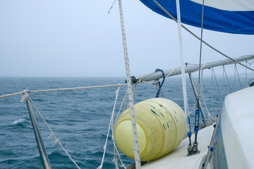 Close up Boat fender details on Cruising yacht. Sailing at summer foggy day. Yachting concept and...