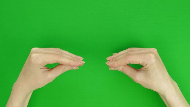 Female hands show symbolic conversation, dialogue. Chroma key, green screen background.
