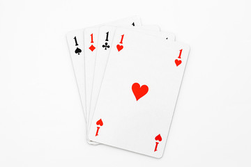 Four aces on white background