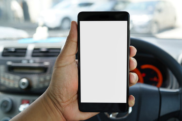 Cropped shot view of man hand holding a smartphone inside car with blank copy space screen for text message or information content