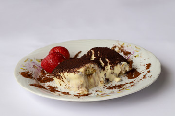 tiramisu dessert, strawberries in white plate.