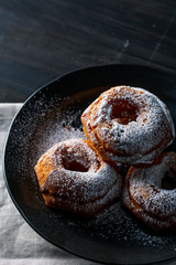 Delicious donut image.
Sprinkled powdered sugar on donuts.

