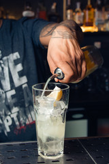Cocktail, glass with ice and lemon