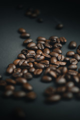 roasted coffee beans on black background 