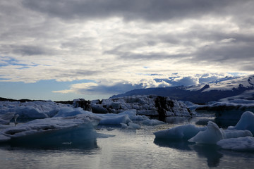 Fototapeta na wymiar Jokulsarlon / Iceland - August 29, 2017: Ice formations and icebergs in Glacier Lagoon, Iceland, Europe