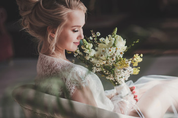 Beautiful bride portrait wedding makeup and hairstyle with bouquet, fashion bride model jewelry and...