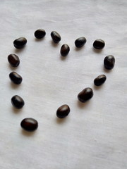 Healthy and lovely heart formed with black pulse grains 