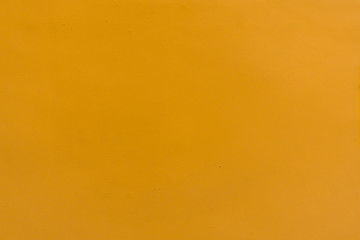 Close-up texture of yellow crepe corrugated blotting paper for DIY. Concept of choice. Soft focus, high contrast, horizontal background shot