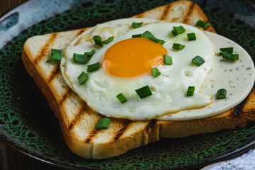fried eggs on toast close up