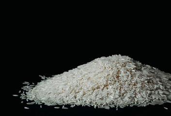 white rice on a black background copy space