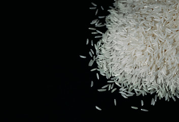 white rice on a black background copy space