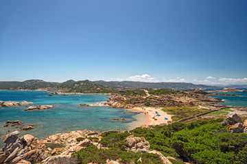 Fototapeta na wymiar Panoramic view of the sunny beaches, and of the clear and transparent waters of the island of Maddalena in Sardinia, Italy.