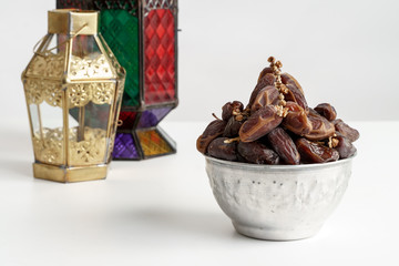 dates palm and arabic lantern on white. eid mubarak background