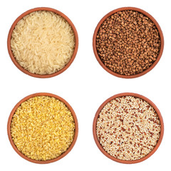 Collection of various grains in bowls isolated on white background. Set of cereals- buckwheat, rice, bulgur, quinoa . Top view.