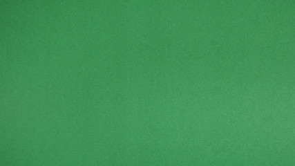 green paper for background.it is empty space and no people.