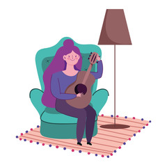 stay at home, young woman sitting playing guitar in room