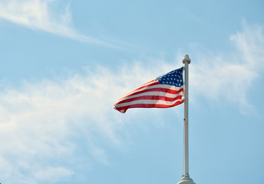 American Flag Waving on a Clear Blue Sky