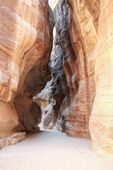 Layer of famous pink stone curving walls of Petra, Jordan