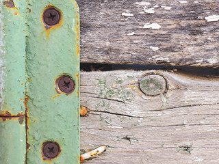 Fragment of a rustic gate in a fence close-up. Old gray weathered wooden beams and door hinge....