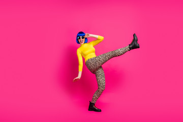 Fototapeta na wymiar Full body photo of funky carefree lady cool students party raise leg up wear retro specs yellow turtleneck blue wig footwear leopard trousers isolated shine pink color background