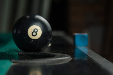 Billiards balls and cue on billiards table. Billiard sport concept