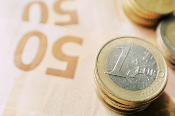 Euro bills and coins, financial Corona Virus crisis.