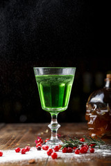 absinthe in an old wineglass