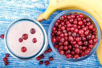 cottage cheese with cranberries and banana on the table