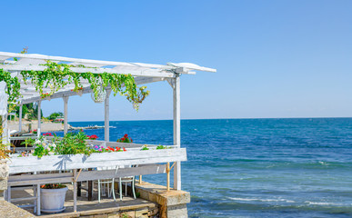 Summer terrace of the restaurant on the sea coast.