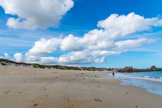 Empty blue sea and white sand beach background with copy space in Brittany