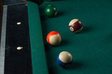 Billiards balls and cue on billiards table. Billiard sport concept