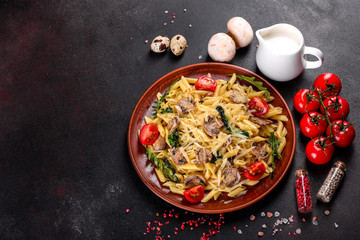 Pasta with mushrooms, cheese, spinach, rukkola and cherry tomatoes