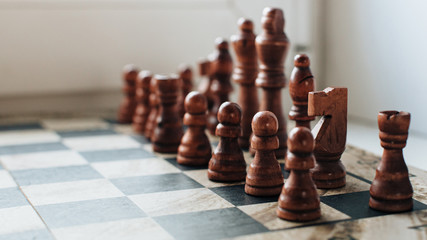 chess stands in a row on the chessboard