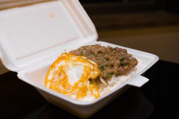 Rice with beef & a fried egg (take away). Delicious signature meal from the cheapest Michelin Star restaurant in the world, Tim Ho Wan. Hong Kong food. 