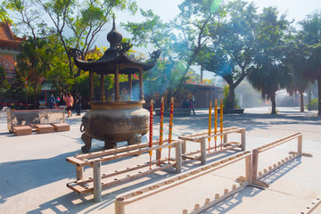Po Lin Monastery, burning incense (Lantau Island, Hong Kong, China). Burning incense outside of the...