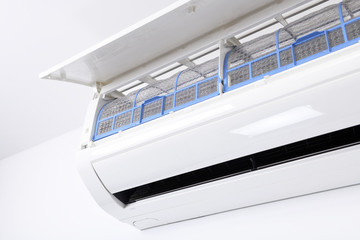 Air conditioner system on white wall room. Air conditioning.A white air conditioner is installed on...