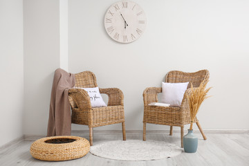 Interior of modern room with wicker armchairs
