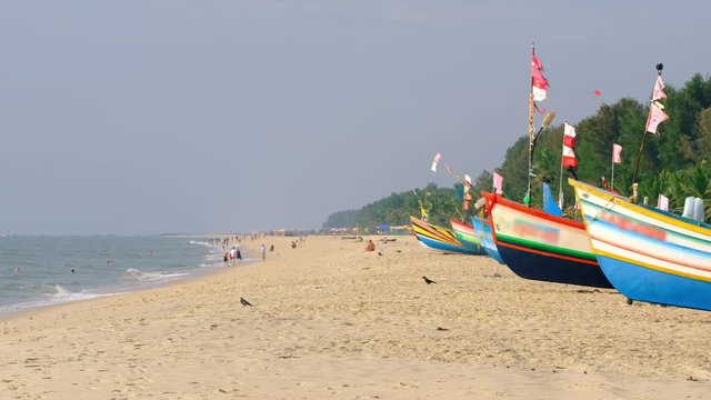 Traditional fishing boats on the famous Marari beach in Kerala, India 
