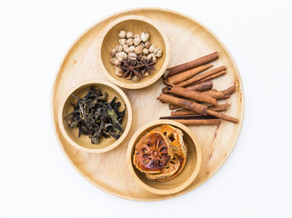 Dry spices in round wooden tray, variety of Asian spice in wooden bowl, Thai herbs, healthy food