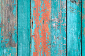 Fototapeta na wymiar bright turquoise wood background. Old wooden slats with peeling paint of brown and aquamarine color, texture..Perfect as a background for Summer Holiday or seaside themes.